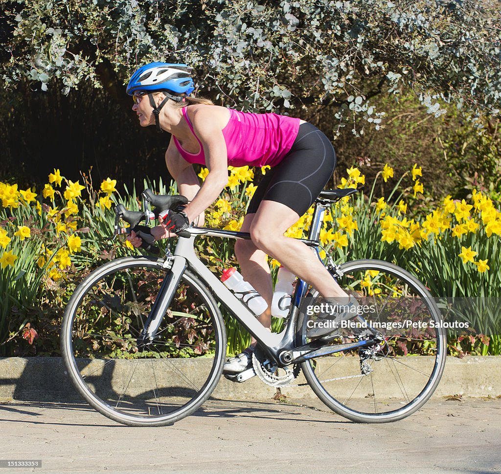 Caucasian woman riding bicycle