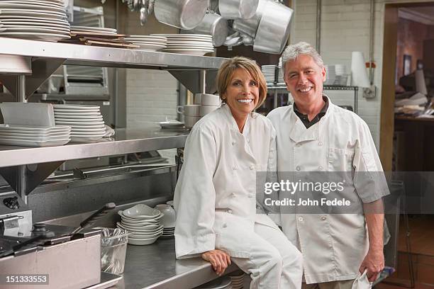 caucasian chefs in commercial kitchen - chef team stock pictures, royalty-free photos & images