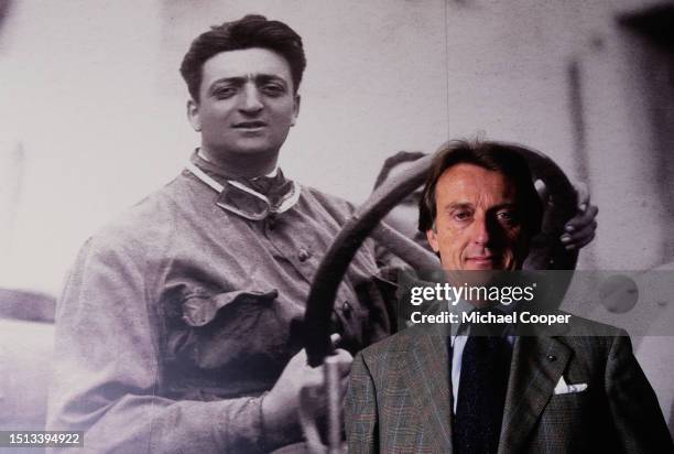 Portrait of Chief Executive Officer and Chairman of Ferrari, Luca Di Montezemolo standing in front of a picture of Scuderia Ferrari founder Enzo...