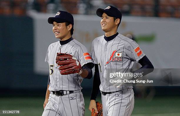 Shohei Otani of Japan celebrates with his team mate Fumiya Hojo after the 18U Baseball World Championship match between Japan and South Korea at...