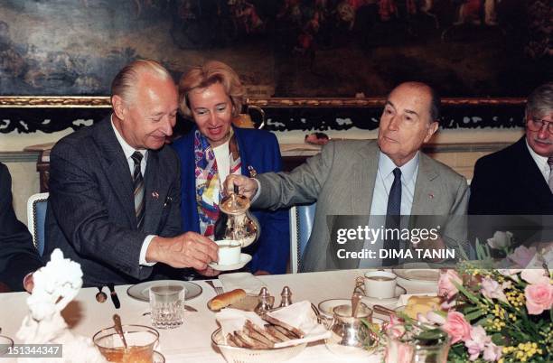 French President Francois Mitterrand pours a cup of tea to the to Slovak politician Alexander Dubcek, former secretary general of Czechoslovak...