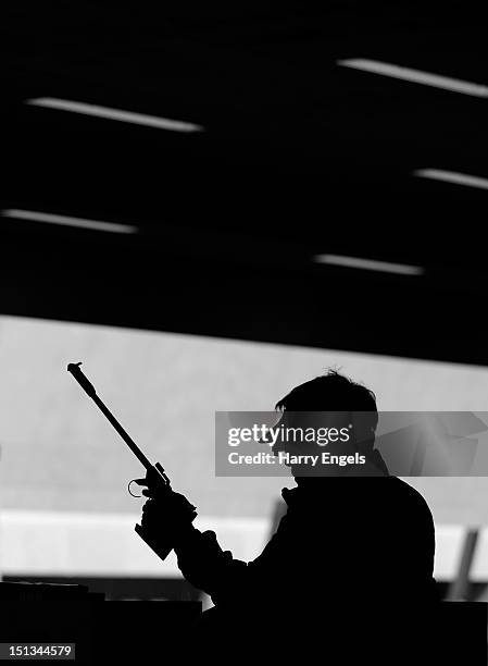 Seakyun Park of the Republic of Korea loads his pistol during the Mixed P4-50m Pistol-SH1 qualifying round on day 8 of the London 2012 Paralympic...