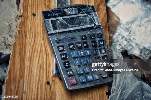 Broken calculator lies amid the rubble of a restaurant hit by a Russian missile on June 30, 2023 in Kramatorsk, Ukraine. In the city of Kramatorsk,...