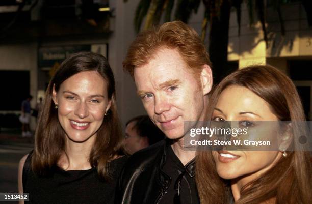 Actor David Caruso and wife Margaret, left, and friend Amparo Grisales pose for photographers at the premiere of "Steal This Movie" at Lammele's...