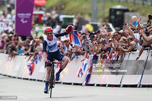 Sarah Storey of Great Britain celebrates winning gold in the Women's Individual C4-5 Road Race during the road cycling on day 8 of the London 2012...