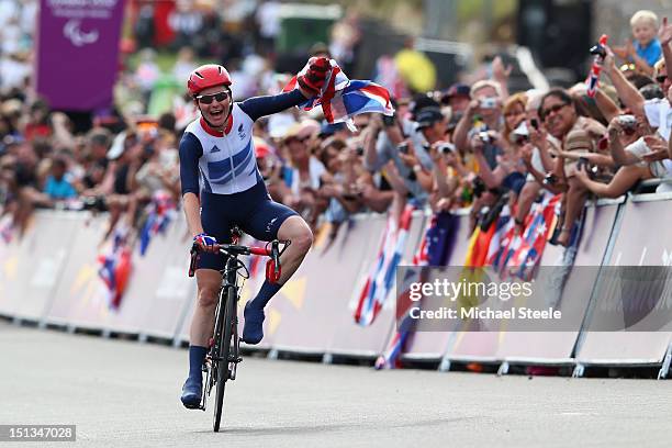 Sarah Storey of Great Britain celebrates winning gold in the Women's Individual C4-5 Road Race during the road cycling on day 8 of the London 2012...