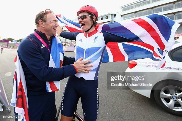 Sarah Storey of Great Britain celebrates with her husband Barney Storey after winning gold in the Women's Individual C4-5 Road Race during the road...