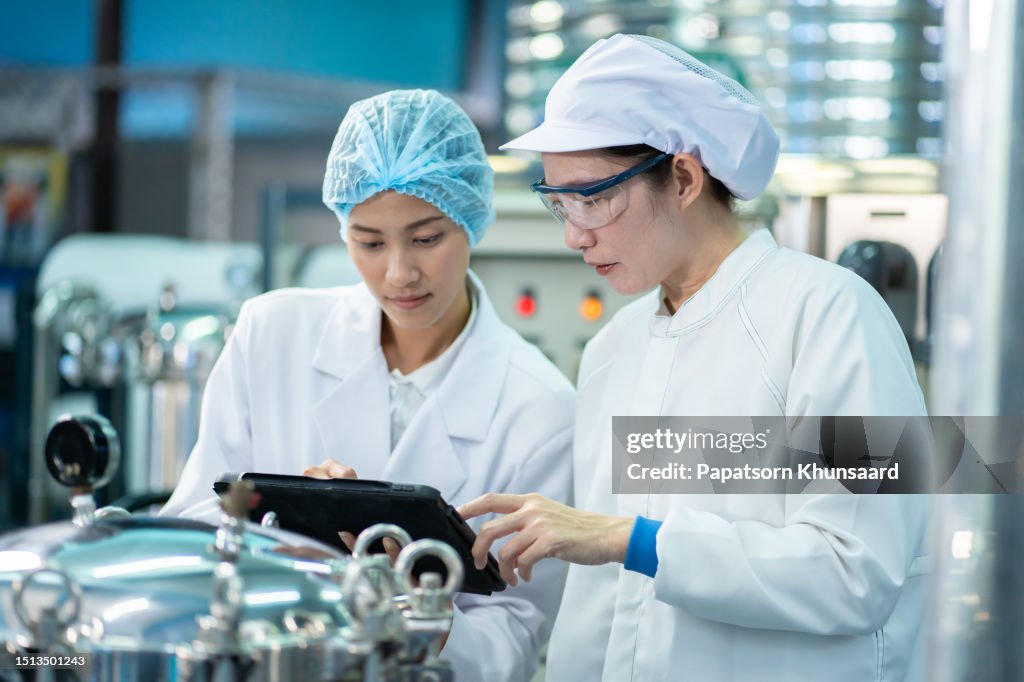 Asian woman teaching team work in working on food and beverage safety.