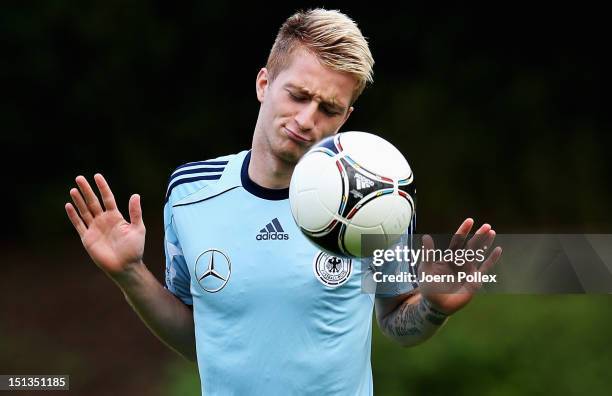 Marco Reus of Germany gestures during a training session ahead of their FIFA World Cup Brazil 2014 qualifier against the Faroe Islands on September...