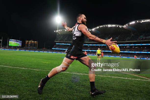 Charlie Dixon of the Power kicks the ball during the 2023 AFL Round 17 match between the Port Adelaide Power and the Gold Coast Suns at Adelaide Oval...