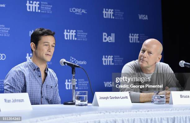 Actors Joseph Gordon-Levitt and Bruce Willis attend the "Looper" press conference during the 2012 Toronto International Film Festival at TIFF Bell...