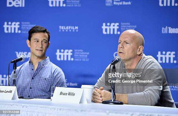 Actors Joseph Gordon-Levitt and Bruce Willis attend the "Looper" press conference during the 2012 Toronto International Film Festival at TIFF Bell...