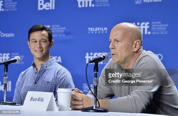 Actors Joseph Gordon-Levitt and Bruce Willis attend the "Looper" press conference during the 2012 Toronto International Film Festival at TIFF Bell...