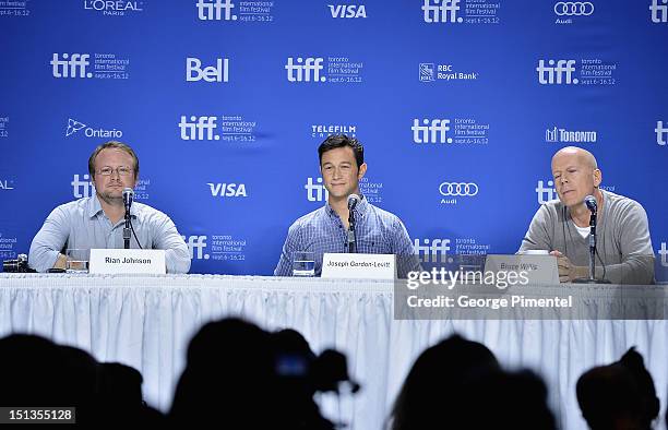 Director Rian Johnson, actor Joseph Gordon-Levitt and actor Bruce Willis attend the "Looper" press conference during the 2012 Toronto International...