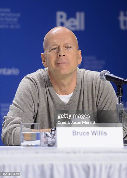 Actor Bruce Willis speaks onstage at the "Looper" press conference during the 2012 Toronto International Film Festival at TIFF Bell Lightbox on...