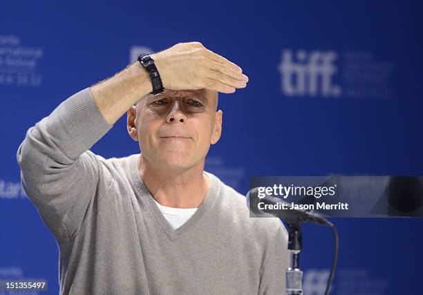 Actor Bruce Willis speaks onstage at the "Looper" press conference during the 2012 Toronto International Film Festival at TIFF Bell Lightbox on...