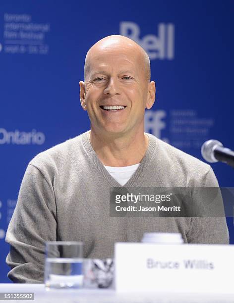 Actor Bruce Willis speaks onstage at the "Looper" press conference during the 2012 Toronto International Film Festival at TIFF Bell Lightbox on...