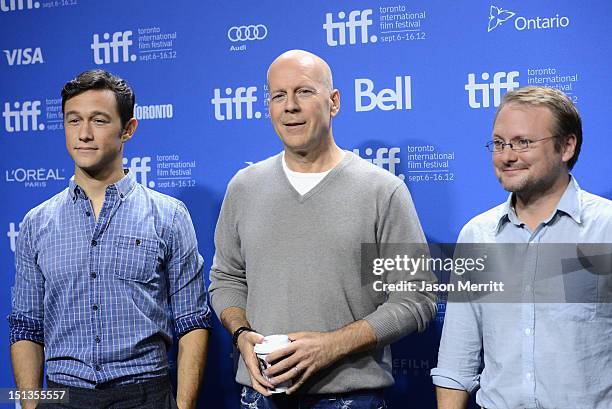 Actors Joseph Gordon-Levitt, Bruce Willis and Director Rian Johnson speak onstage at the "Looper" press conference during the 2012 Toronto...