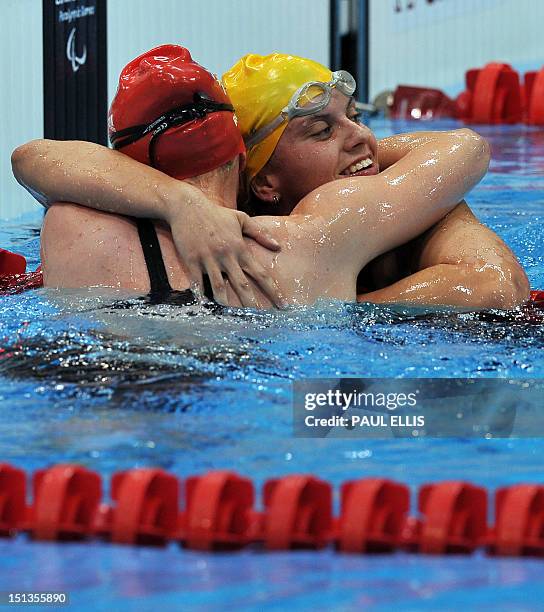 Australia's Jacqueline Freney embraces Britain's Susannah Rodgers after winning and setting a new world record in the women's 400m freestyle S7...