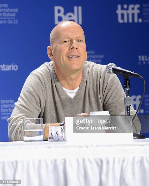 Actor Bruce Willis speaks onstage at the "Looper" press conference during the 2012 Toronto International Film Festival at TIFF Bell Lightbox on...