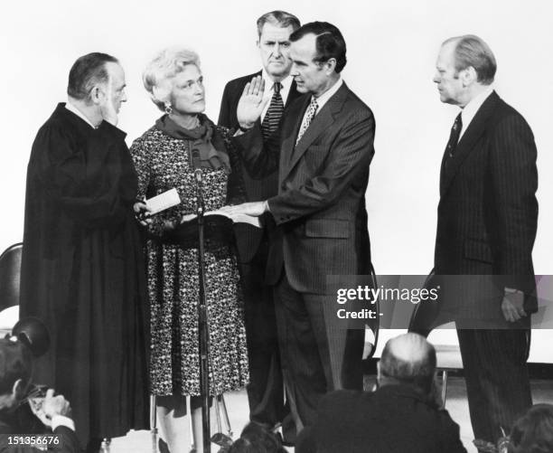 George Herbert Walker Bush is pictured with the Minister of Justice, Baxter Stewart , his wife Barbara Bush, CIA's vice director Vernon Walters and...