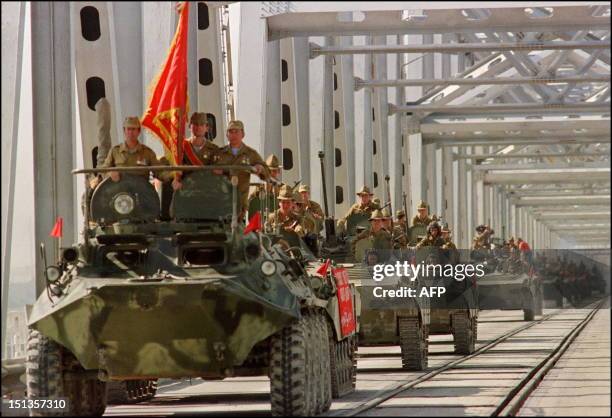 Convoy of Soviet Army armoured personal vehicles cross a bridge in Termez, 21 May 1988 at Soviet-Afghan border, during the withdrawal of the Red Army...