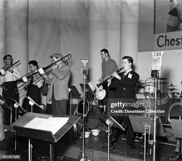 Glenn Miller and members of his orchestra perform with the Glenn Miller Orchestra for CBS radio at the Chesterfield Radio Playhouse in Times Square...