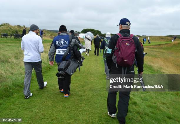 Lee Slattery of England walks to the 10th hole with his caddie during The Open Final Qualifying at Dundonald Links Golf Course on July 04, 2023 in...