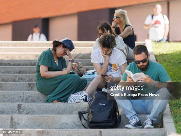 Several students review before the start of an exam of the extraordinary call of the University Entrance Examination , outside the Mostoles campus of...