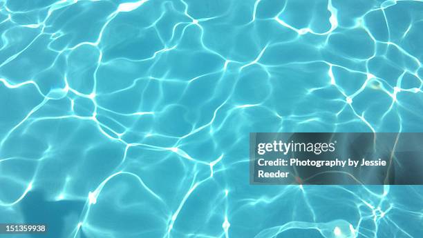 surface of a swimming pool - turquesa fotografías e imágenes de stock