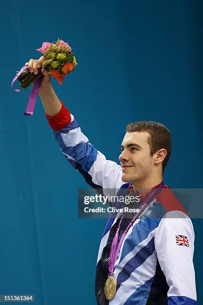 Gold medallist Josef Craig of Great Britain poses on the podium during the medal ceremony for the Men's 400m Freestyle - S7 finalon day 8 of the...