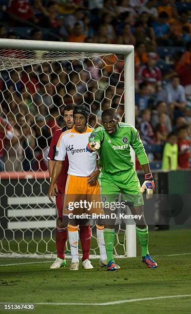 Goalkeeper Sean Johnson of Chicago Fire points as teammate Gonzalo Segares Calen Carr of Houston Dynamo line up for a corner kick and at Toyota Park...