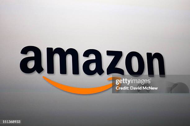 The Amazon logo is projected onto a screen at a press conference on September 6, 2012 in Santa Monica, California. Amazon unveiled the Kindle...