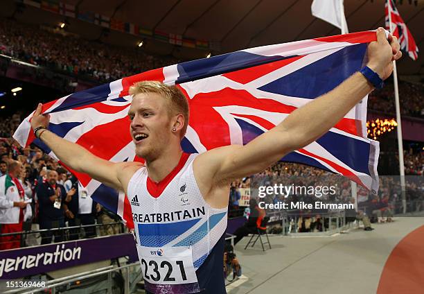 Jonnie Peacock of Great Britain celebrates winning gold in the Men's 100m - T44 Final on day 8 of the London 2012 Paralympic Games at Olympic Stadium...