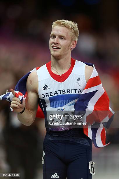 Jonnie Peacock of Great Britain celebrates winning gold in the Men's 100m - T44 Final on day 8 of the London 2012 Paralympic Games at Olympic Stadium...