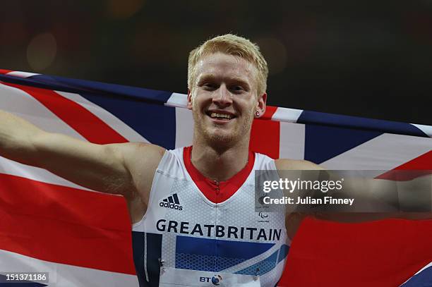 Jonnie Peacock of Great Britain celebrates winning gold in the Men's 100m - T44 Final on day 8 of the London 2012 Paralympic Games at Olympic Stadium...