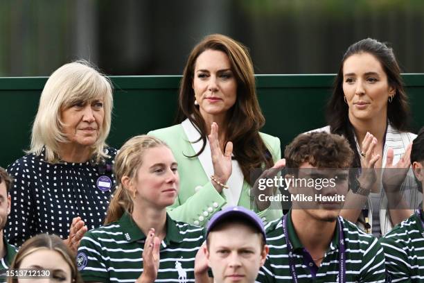 Catherine, Princess of Wales is seen with Deborah Jevans and Laura Robson as they applaud during the Women's Singles first round match between Katie...