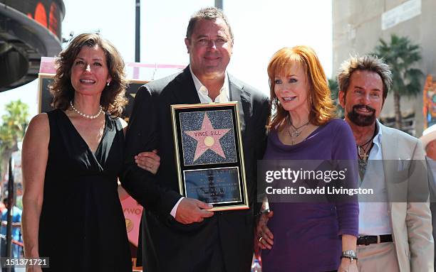 Recording artists Amy Grant, Vince Gill and Reba McEntire and record producer Tony Brown attend Gill being honored with a Star on the Hollywood Walk...