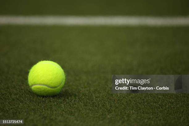 Tennis match ball on the grass court during the Wimbledon Lawn Tennis Championships at the All England Lawn Tennis and Croquet Club at Wimbledon on...