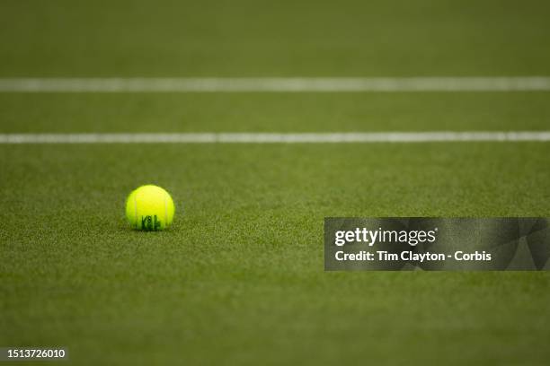 Tennis match ball on the grass court during the Wimbledon Lawn Tennis Championships at the All England Lawn Tennis and Croquet Club at Wimbledon on...