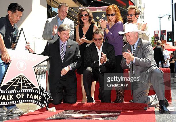 Country singer and songwriter Vince Gill is honored with a star on the Hollywood Walk of Fame, in Hollywood, California, on September 6, 2012. AFP...