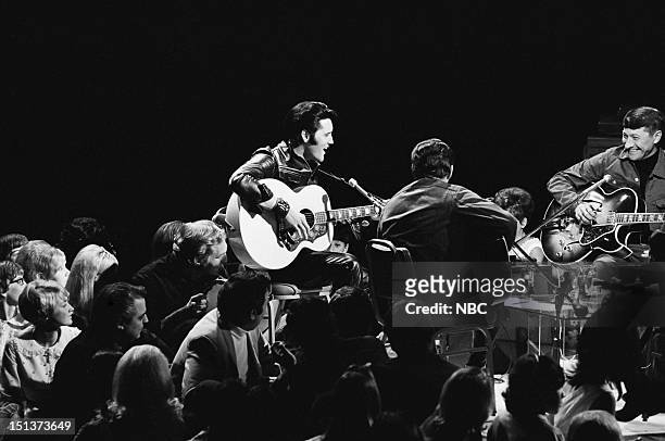 Pictured: Elvis Presley, guitarist Charlie Hodge, guitarist Scotty Moore during his '68 Comeback Special on NBC --
