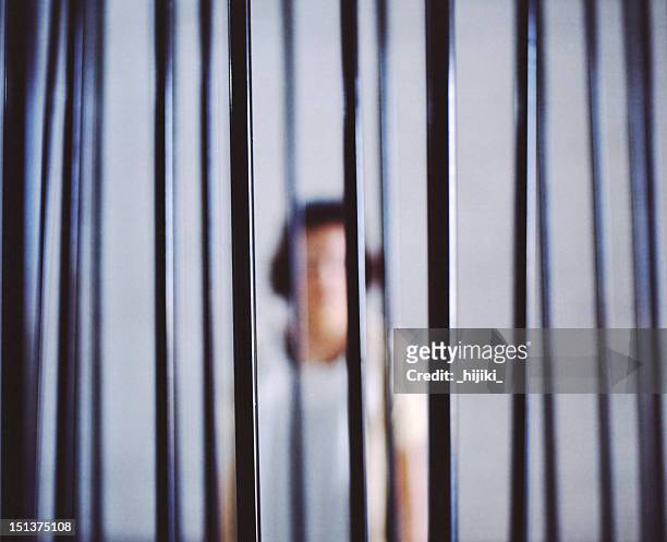 woman in jail - prison foto e immagini stock