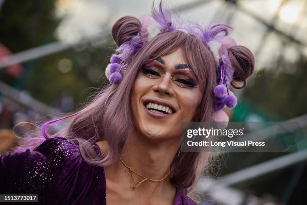 People take part by waving LGTBIQ+ flags and dancing during the International Pride Parade in Bogota, Colombia, July 2, 2023.