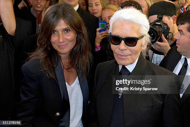Emmanuelle Alt and Karl Lagerfeld attend Vogue Fashion Night Out 2012 on September 6, 2012 in Paris, France.