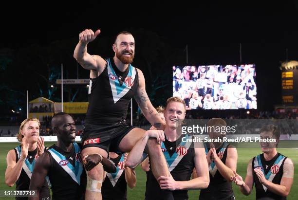 Charlie Dixon of the Power gets chaired off in his 200th game during the 2023 AFL Round 17 match between the Port Adelaide Power and the Gold Coast...