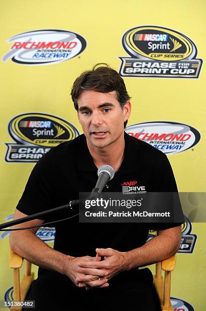 Jeff Gordon, driver of the Drive to End Hunger Chevrolet, speaks to members of the media at Richmond International Raceway on September 6, 2012 in...