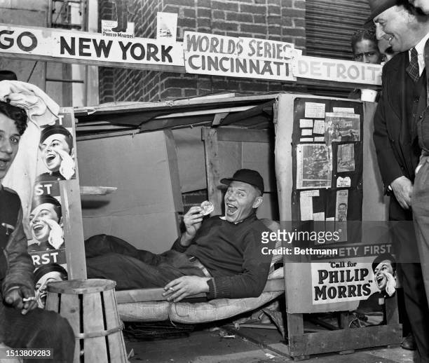 Art "Happy" Felsh - a determined fan waits in his man-made bunk to watch the world series game between the Cincinnati Reds and Detroit Tigers, United...