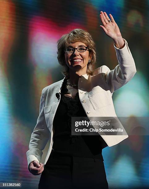 Former U.S. Rep. Gabrielle Giffords waves on stage during the final day of the Democratic National Convention at Time Warner Cable Arena on September...