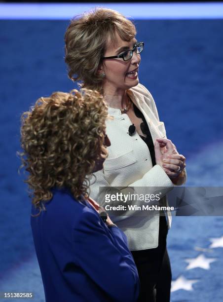 Former U.S. Rep. Gabrielle Giffords says the Pledge of Allegiance on stage with Democratic National Committee Chair, U.S. Rep. Debbie Wasserman...